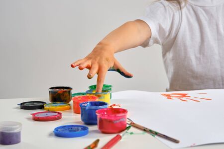 Little artist in a white t-shirtの写真素材