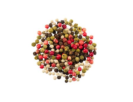 Small portion of mixed peppercorns isolated on white background with copy space for text or images. Spices and herbs. Food, cooking, restaurant, packaging concept. Frame composition, close-up, top view.の写真素材