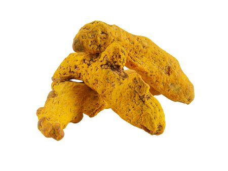Three turmeric roots isolated on white background with copy space for text or images. Spices and herbs. Food, cooking, restaurant, packaging concept. Frame composition, close-up, side view.の写真素材