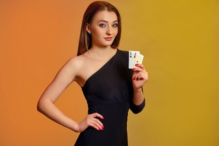 Blonde model showing two aces