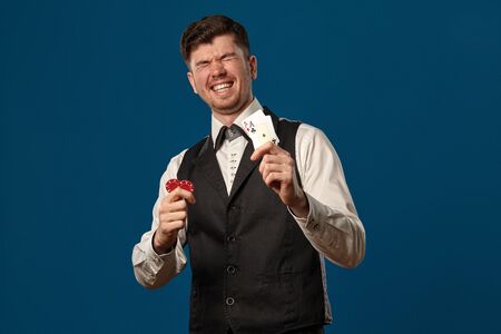Newbie in poker, in black vest and white shirt.