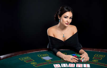 sexy woman with poker cards and chipsの写真素材