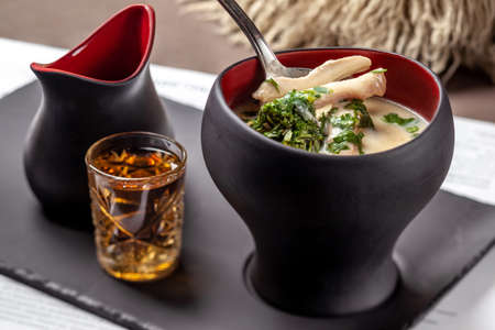 Georgian chikhirtma soup with poultry served with chacha