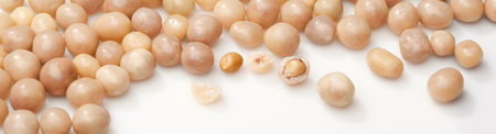 Sweet roasted peanuts in sugar glaze on white surfaceの写真素材