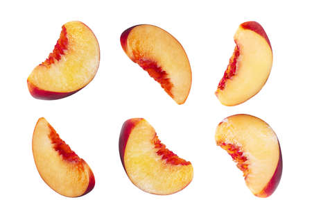 Six unpitted, smooth-skinned nectarine slices isolated on white background with copy space for text...