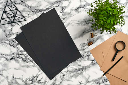 Top view in focus with different office equipment, supplies, stationery. Marble table with copy space. Education, workplace background. Close-up.の写真素材