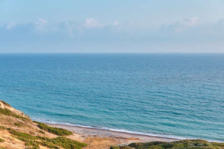 Shot of a picturesque beach of the azure mediterranean sea surrounded by a beautiful nature of Cyprus.の写真素材