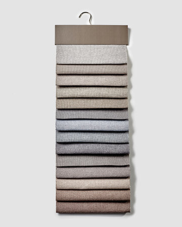 Collection of natural upholstery fabric samples for furniture design