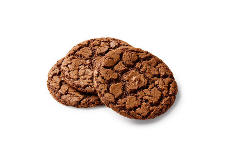 Three chocolate cookies stacked on white backgroundの写真素材