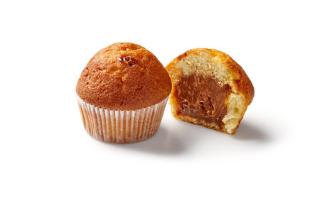 Tasty muffins filled with chocolate cream isolated on a white backgroundの写真素材