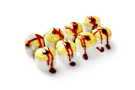 Delicious sushi rolls covered with spicy sauce and cheese cream on white backgroundの写真素材