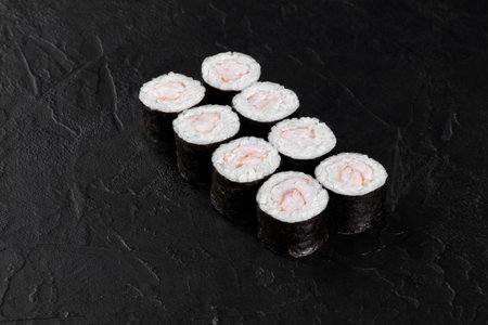 Eight shrimp sushi rolls presenting on dark backgroundの写真素材