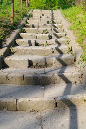 Stone stairs with a balustrade shadowの写真素材