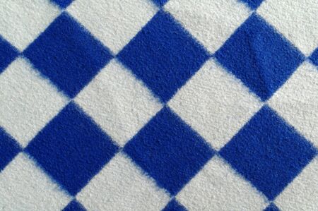 white and blue plaid blanket surface closeup