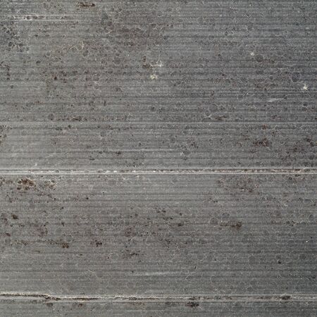 old dirty gray stained rough corrugated cardboard