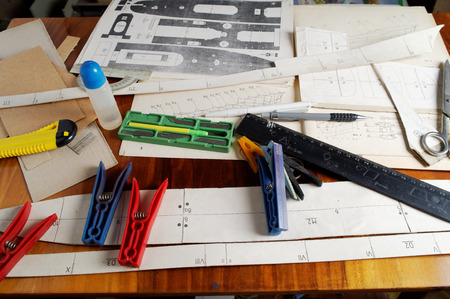 unfinished cardboard warship model on the workshopの写真素材