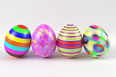 four colorful rendered easter eggs in row on the white backgroundの写真素材