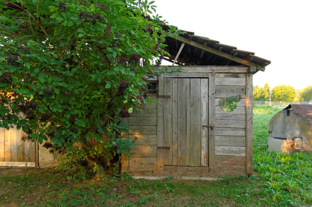 old wooden shed with a crushed mirrorの写真素材