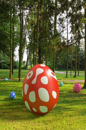 big easter egg on grass in the parkの写真素材