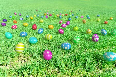 colorful easter eggs on a meadow at the sunny day