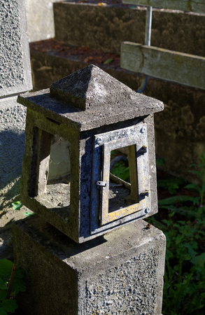 old concrete empty lantern on the graveの写真素材