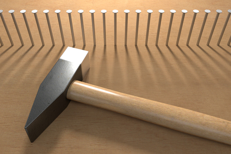 Row of hammered nails and hammer , 3d renderingの写真素材
