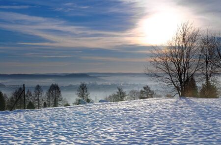 snow covered altitude at the cold winter sunny morningの写真素材