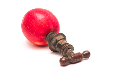 Old style tap in an appleの写真素材