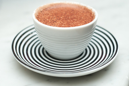 Freshly made cappuccino, close up with chocolate sprinklesの写真素材