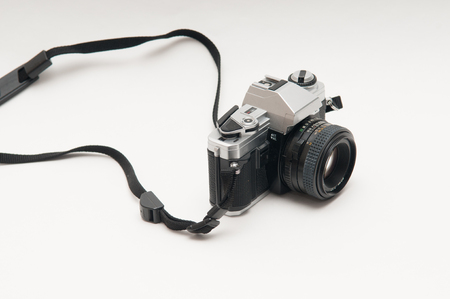 old vintage style film camera on a white backgroundの写真素材