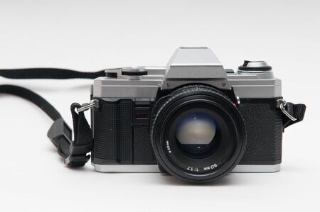 old vintage style film camera on a white backgroundの写真素材