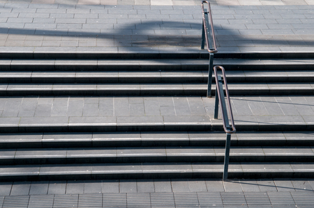 concrete stairs in a city in the afternoon sunの写真素材