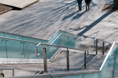 View down steps to a bridge on a sunny dayの写真素材