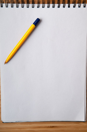 Blank white note pad and pen for writing new ideasの写真素材