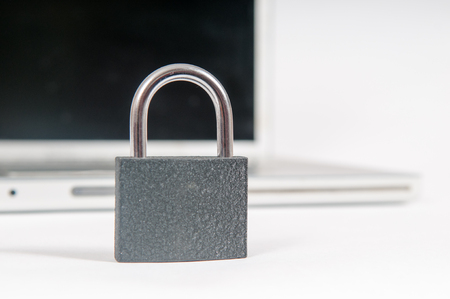 laptop computer being protected from online cyber crime and hackingの写真素材