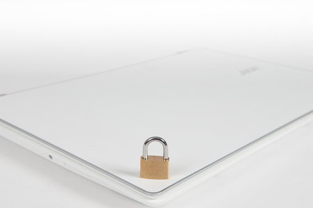 laptop computer being protected from online cyber crime and hackingの写真素材