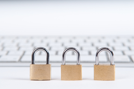 laptop computer being protected from online cyber crime and hackingの写真素材