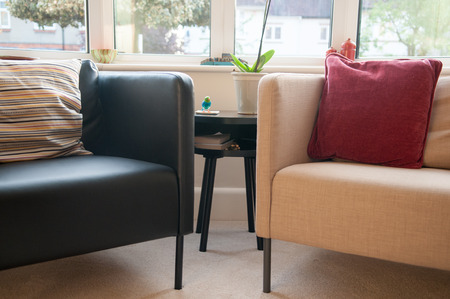 Interior of a neutral colored living room with two armchairsの写真素材