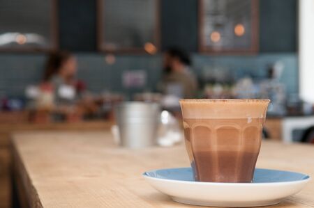 Cafe interior background with fresh coffee on the table in the coffee shopの写真素材
