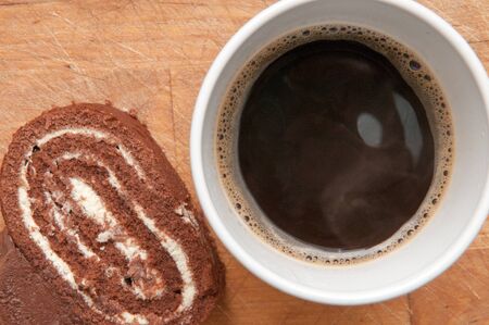 Slice of chocolate cake with a coffee viewed from aboveの写真素材