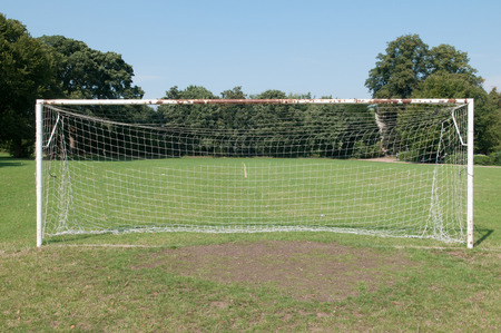 Football pitch goal posts and net on a soccer pitchの写真素材