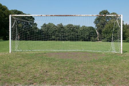 Football pitch goal posts and net on a soccer pitchの写真素材