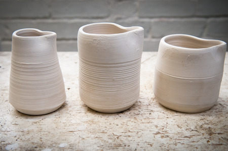 Hand made ceramic pots in the studio in natural daylightの写真素材