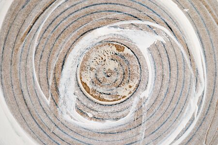 circular pattern on a wooden background made with paintの写真素材