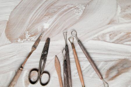 Pottery making tools on a white deskの写真素材