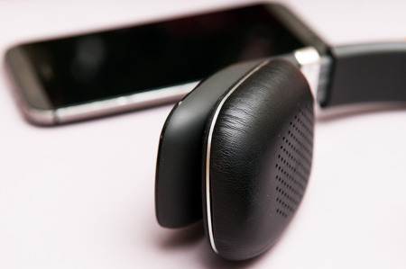 Listening to music on a mobile phoneの写真素材