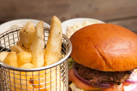 burger and fries on a white cafe backgroundの写真素材