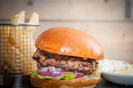 burger and fries on a white cafe backgroundの写真素材