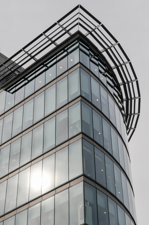 office building exterior with large glass windowsの写真素材