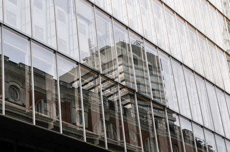 high rise office block viewed from below, looking up from ground levelの写真素材